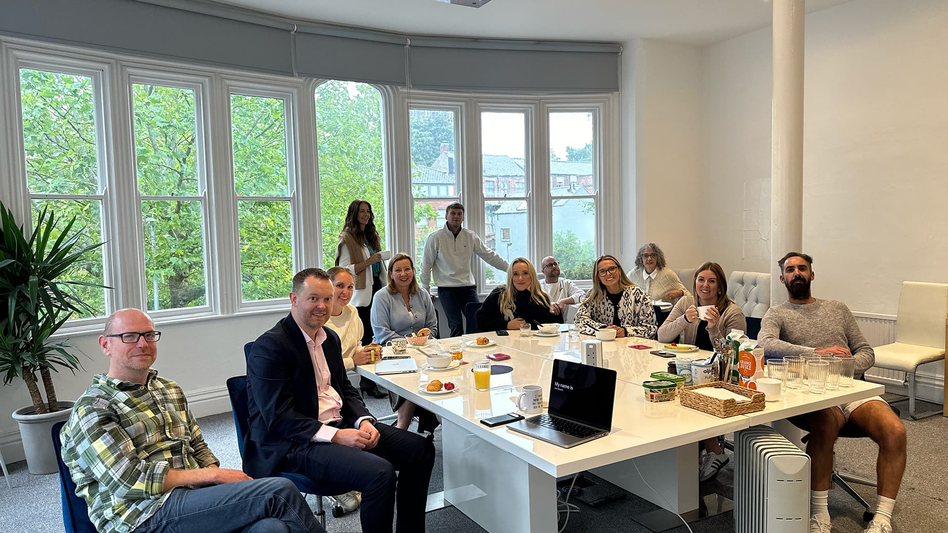 The SANDBOX team sat around the table in our boardroom.